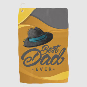 A yellow and grey towel with a hat and Best Dad