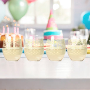 a yellow and white background with small circles stemless wine glass