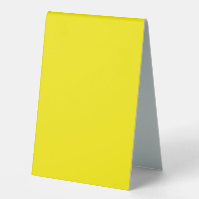 a yellow background with a black border (Front)