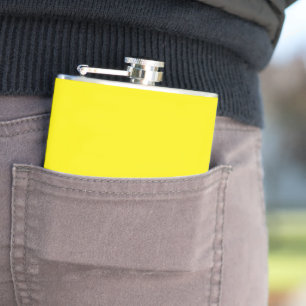 a yellow background with a black border hip flask