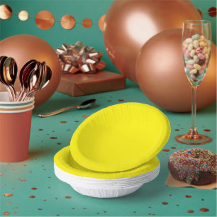 a yellow background with a black border paper plate