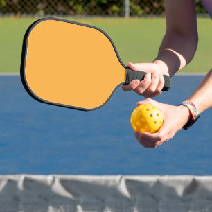 a yellow background with a black border pickleball paddle