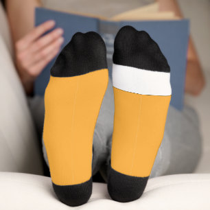 a yellow background with a socks