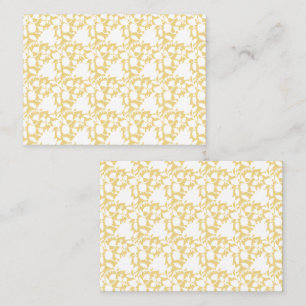 A yellow rug with a repeating motif pattern resemb place card