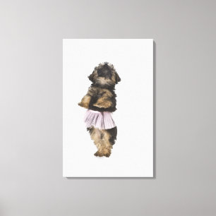 A Yorkie-poo puppy in a tutu on her hind legs. Canvas Print