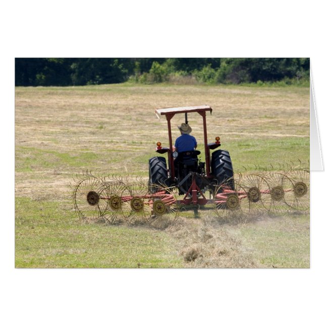 A young boy driving a tractor harvesting (Front Horizontal)
