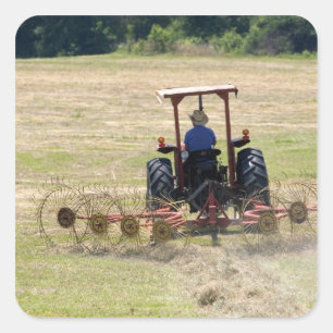 A young boy driving a tractor harvesting square sticker