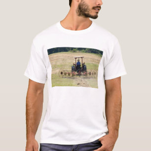 A young boy driving a tractor harvesting T-Shirt