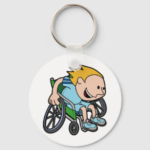 A young boy racing in a wheelchair key ring