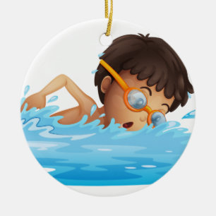 A young boy swimming with a yellow goggles ceramic tree decoration