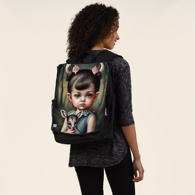 A young girl holding a deer in her arms backpack (Worn)