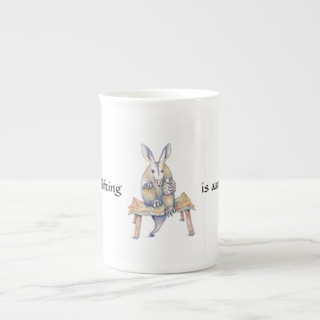 Aardvark cartoon sitting and drinking from a mug (Front)