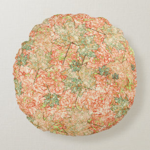 Abstract acer leaves upon scratched coral ground round cushion