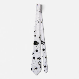 abstract black flecks on white tie