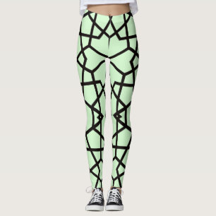 Abstract black lines pattern on light green leggings
