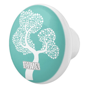 Abstract circle tree and name on light teal ceramic knob