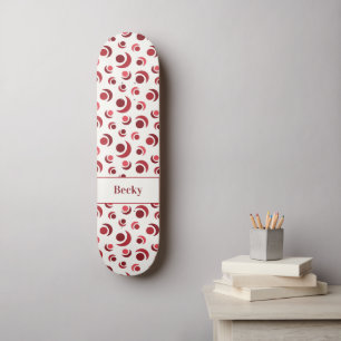 Abstract circles and crescents in red plus Name Skateboard