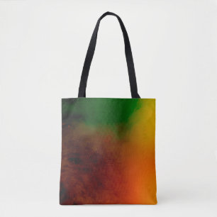 abstract colored dust explosion on a black backgro tote bag