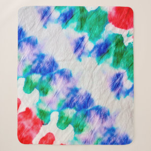 Abstract colorful tie dye pattern on a crumpled wh sherpa blanket