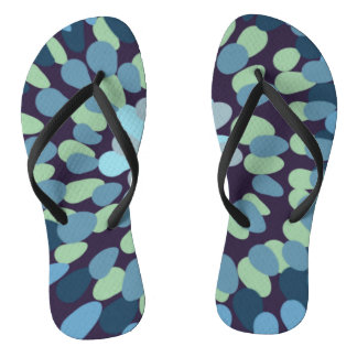 Abstract design in muted greens and grey flip flops