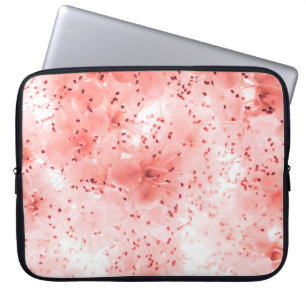 Abstract floral backdrop of pink flowers over past laptop sleeve