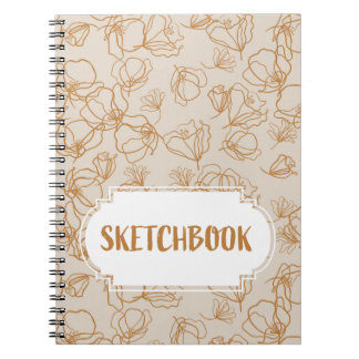 Abstract flowers over beige notebook