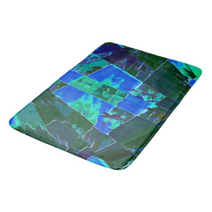 Abstract green pasture parts and blue sky, notched bath mat