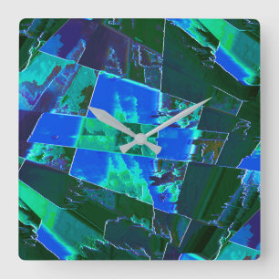 Abstract green pasture parts and blue sky, notched square wall clock