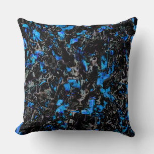 Abstract looking bat wings over stained turquoise cushion