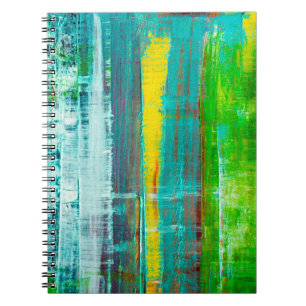 Abstract painted canvas. Oil paints on a palette. Notebook