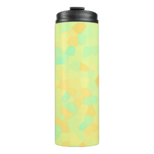 Abstract pattern of yellow and green shapes thermal tumbler