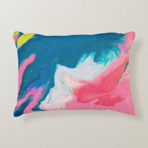 Abstract pink and turquoise paint background with decorative cushion