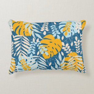 Abstract seamless pattern with tropical leaves and decorative cushion