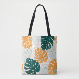 Abstract seamless pattern with tropical leaves and tote bag