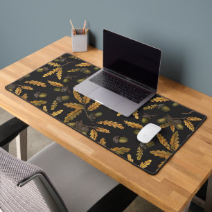 Acorns and oak leaves on black desk mat