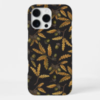 Acorns and oak leaves on black