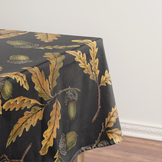 Acorns and oak leaves on black tablecloth (In Situ)