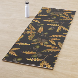 Acorns and oak leaves on black yoga mat
