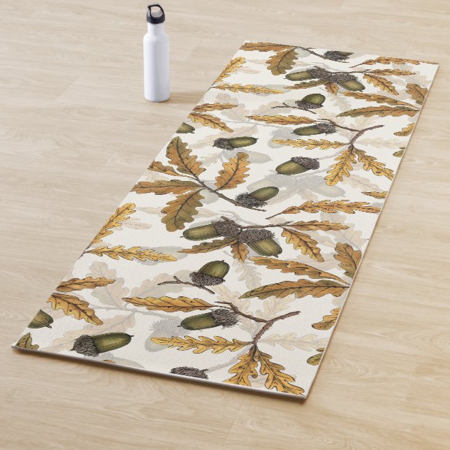 Acorns and oak leaves on off white yoga mat (In Situ)