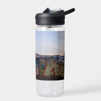 Across the wicker water bottle