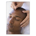 Acupuncture. Acupuncturist inserting a needle