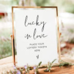 ADELLA Minimalist Lucky in Love Sign<br><div class="desc">This lucky in love sign features an edgy handwritten font and modern minimalist design. Easily change the colours and edit *most* wording to meet the needs of your occasion. This sign is perfect for your contemporary, minimalist, or modern wedding, bridal shower, or couples shower. Pair with additional items from the...</div>