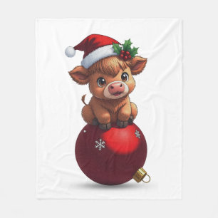 adorable baby highland cow sitting fleece blanket