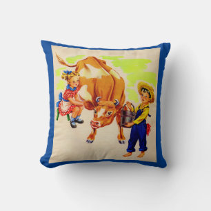 adorable children with adorable cow cushion