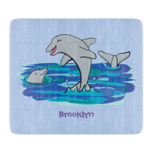 Adorable happy dolphins cartoon illustration cutting board