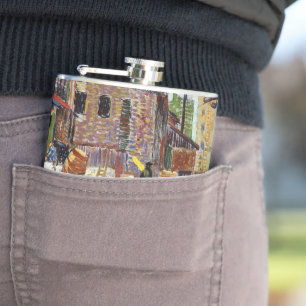 Adorable playful fluffy cute kitten in the city hip flask