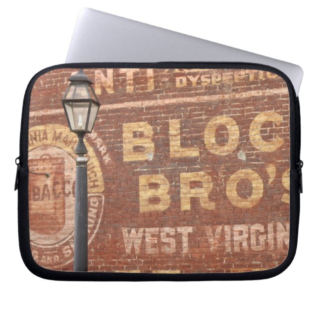 Advertisements on side of building laptop sleeve (Front)