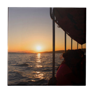 Aegean lifestyle on boat at sunset in summer tile