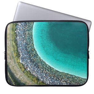 Aerial photography of body of water surrounded wit laptop sleeve