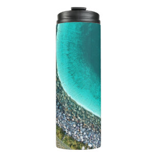 Aerial photography of body of water surrounded wit thermal tumbler